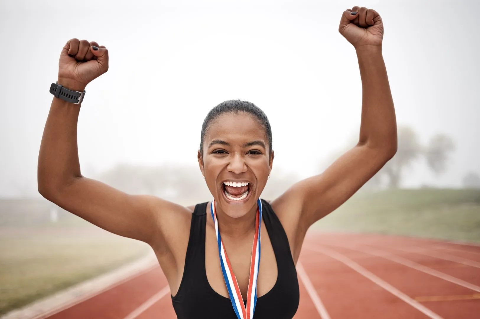 Shot Of A Beautiful Young Female Athlete Celebrati